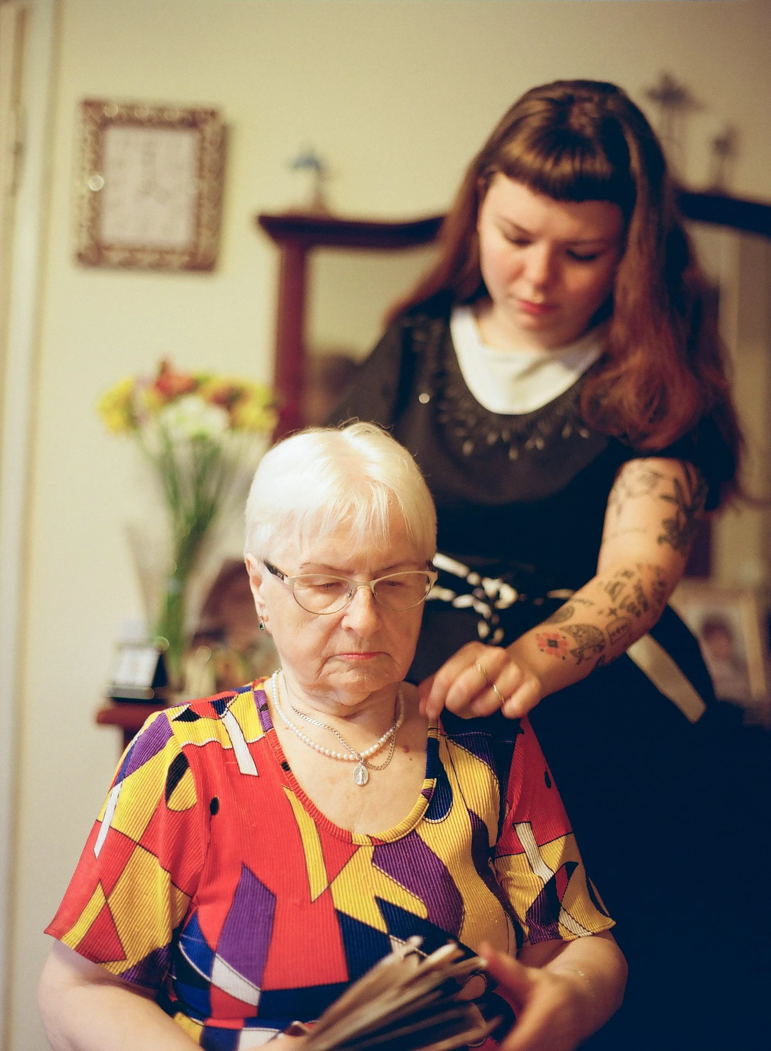Two people together in a domestic interior